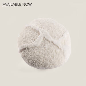 Small round white high-end leather cushion made by Norki.