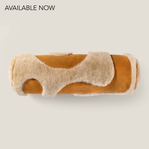 Buy a long cushion in the shape of a leather and shearling duffel, handmade in France by Norki.