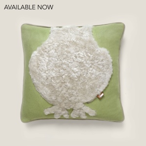 Almond green square cushion with a childish and playful owl pattern in gray sheepskin