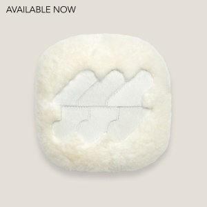 Quality white cushion with a pattern in the center and rounded corners made in France by Maison Norki.