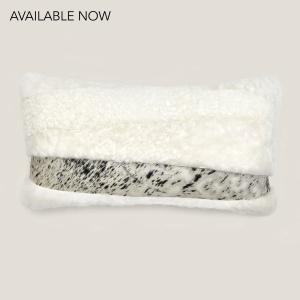 Square Zima rectangle cushion in mottled cowhide and natural sheepskin.