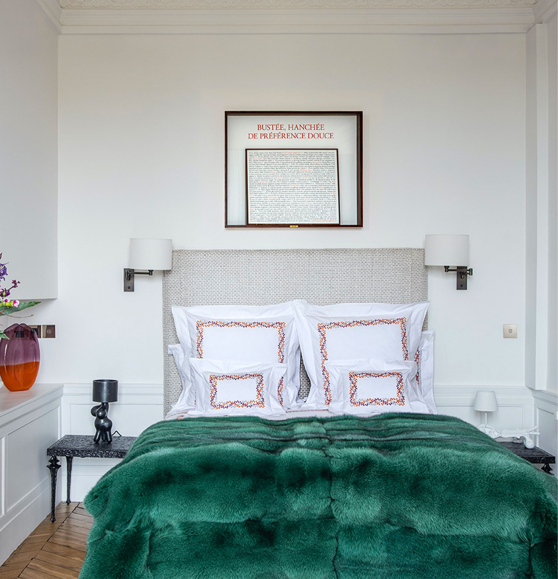 Green tinted Fox throws for the bedroom of a Haussmann-style flat.