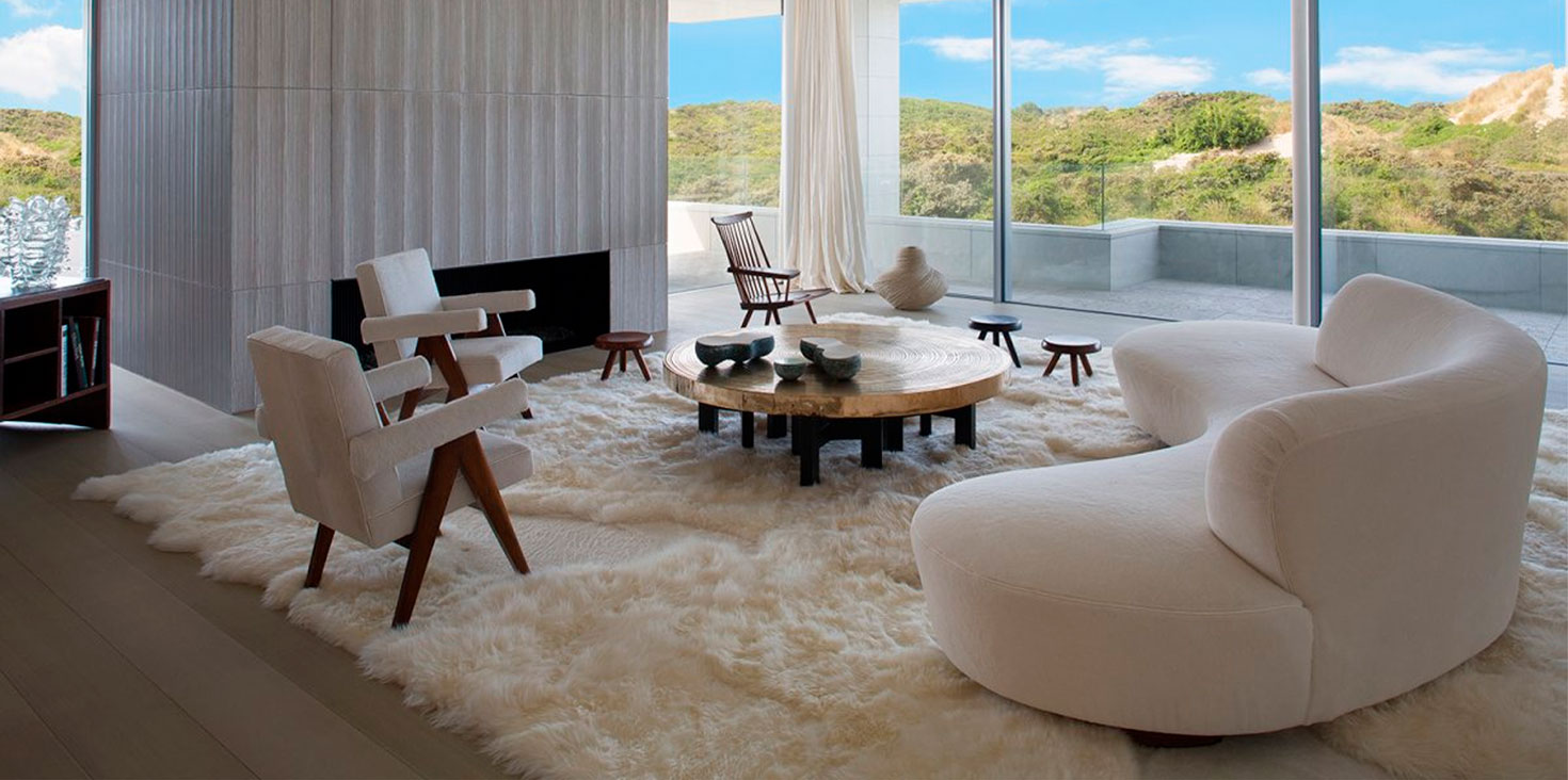 The interior design is by architect Olivier Dweck. Maison Norki renovated armchairs by Pierre Jeanneret, and produced its tailor-made Khan sheepskin and shearling rug.