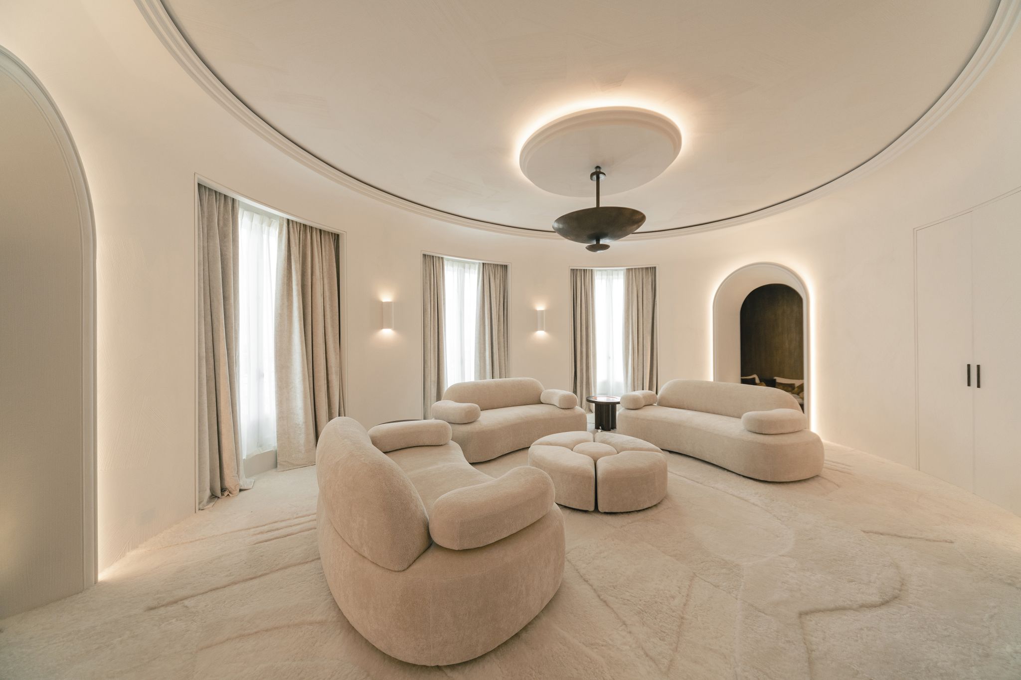 Bryan O'Sullivan was responsible for the interior design of this Parisian private hotel, and Norki produced white shaved lambskin cushions for the marble armchairs designed by Stéphane Parmentier.